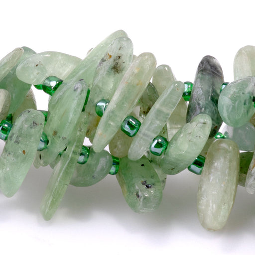 This is a Dakota Stones 5x10-20mm Green Kyanite Top Drill Teeth Gemstone strand of round beads in 15-16 inch strand.