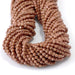 This is a Dakota Stones 3-4mm Special Price Goldstone Gemstone strand with faceted round beads in 15 inch strand.