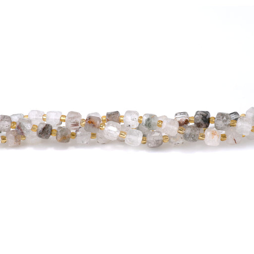 This is a Dakota Stones 6-7mm Green Lodalite Quartz Copy Gemstone strand with table-cut cube beads in 15-16 inch strand.