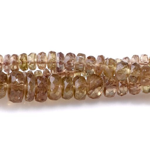 This is a Dakota Stones 3-6mm Champgne Garnet Gemstone strand with faceted rondelle beads in 17-18 inch strand.