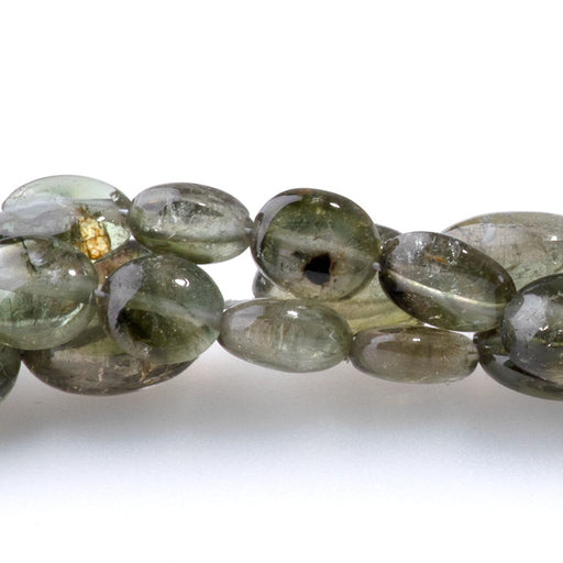 This is a Dakota Stones 4x5-7x9mm Green Tourmaline Gemstone strand with nugget beads in 15-16 inch strand.
