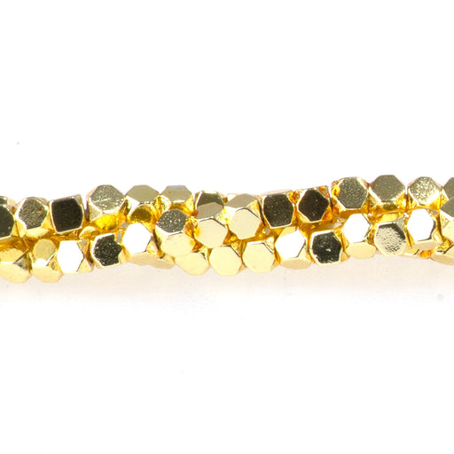 This is a Dakota Stones 2mm Cut Hematite Dark Gold Plated Gemstone strand with cube beads in 15-16 inch strand.