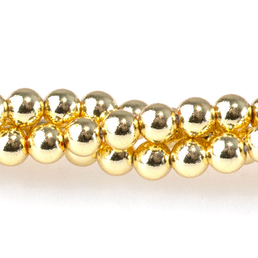 This is a Dakota Stones 4mm Hematite Dark Gold Plated Gemstone strand with round beads in 15-16 inch strand.