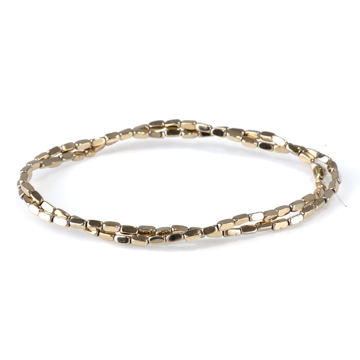This is a Dakota Stones 2x4mm Hematite Pyrite Plated Corner Cut Gemstone strand with nugget beads in 15-16 inch strand.