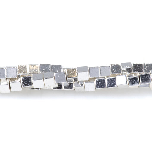This is a Dakota Stones 2mm Hematite White Silver Plated Gemstone strand with cube beads in 15-16 inch strand.