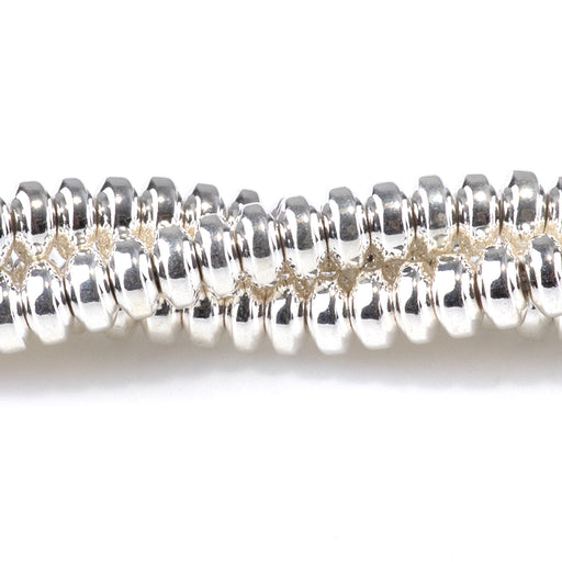 This is a Dakota Stones 4mm Hematite White Silver Plated Gemstone strand with rondelle beads in 15-16 inch strand.