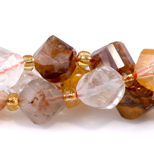 This is a Dakota Stones 7x8mm Golden Hematoid Quartz Swirl Gemstone strand with faceted oval beads in 15-16 inch strand.