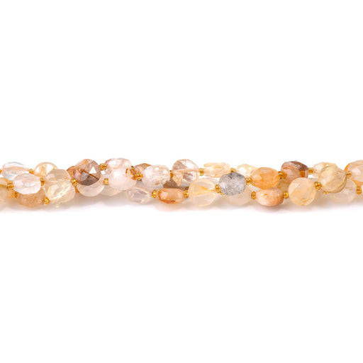 This is a Dakota Stones 8mm Golden Hematoid Quartz Cut Gemstone strand with coin star beads in 15-16 inch strand.