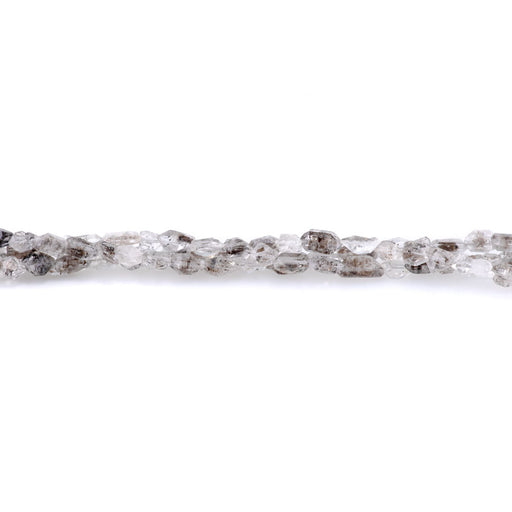 This is a Dakota Stones 5x5-8mm Herkimer Quartz Point Gemstone strand of round beads in 8 inch strand.