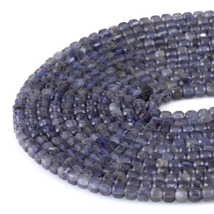 This is a Dakota Stones 4mm Iolite Gemstone strand with natural A grade table-cut cube beads in 15-16 inch strand.
