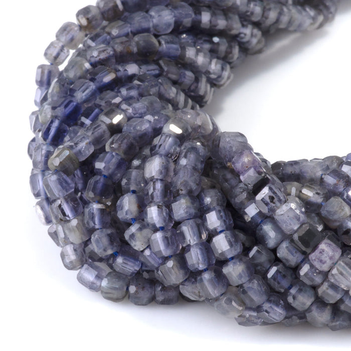 This is a Dakota Stones 4mm Iolite Gemstone strand with natural A grade table-cut cube beads in 15-16 inch strand.