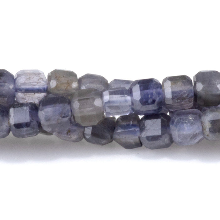 This is a Dakota Stones 4mm Iolite Gemstone strand with natural A grade table-cut cube beads in 15-16 inch strand.