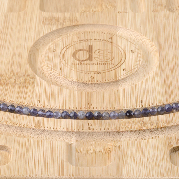 This is a Dakota Stones 4mm Iolite Gemstone strand with AA grade faceted round beads in 15-16 inch strand.