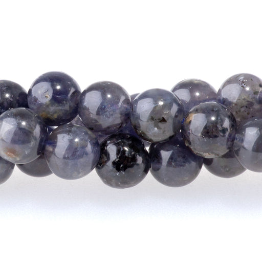 This is a Dakota Stones 6mm Iolite Gemstone strand with A grade round beads in 15-16 inch strand.