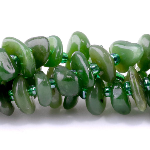 This is a Dakota Stones 5x8mm Canadian Jade Gemstone strand with chip beads in 15-16 inch strand.