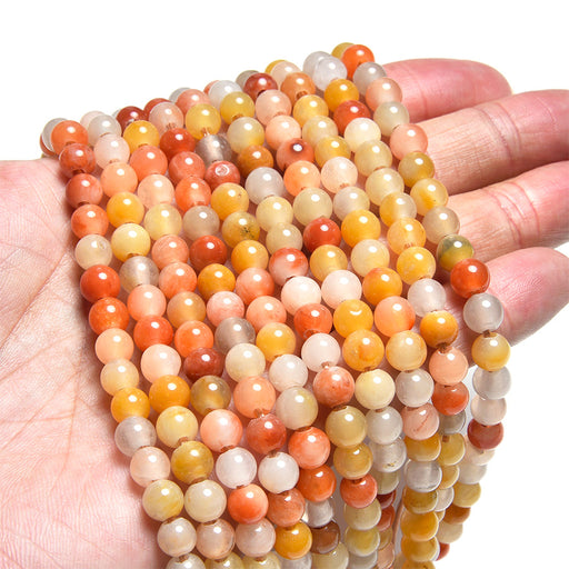 This is a Dakota Stones 6mm Rainbow Jade Large Hole Gemstone strand with round beads in 8 inch strand.