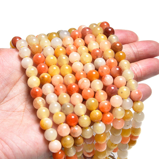 This is a Dakota Stones 8mm Rainbow Jade Large Hole Gemstone strand with round beads in 8 inch strand.