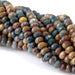 This is a Dakota Stones 5x8mm Kabamby Ocean Jasper Large Hole Gemstone strand with faceted rondelle beads in 8 inch strand.