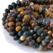 This is a Dakota Stones 5x8mm Kabamby Ocean Jasper Large Hole Gemstone strand with faceted rondelle beads in 8 inch strand.