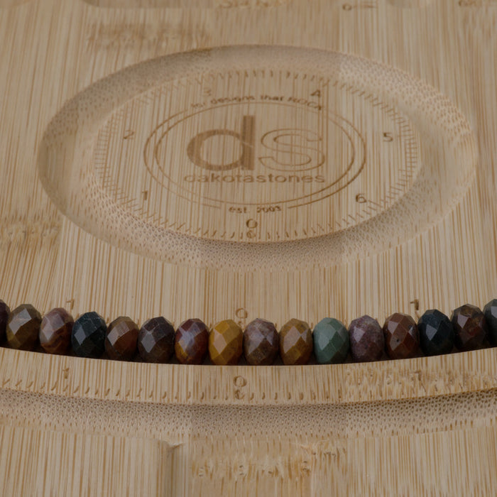 This is a Dakota Stones 5x8mm Kabamby Ocean Jasper Large Hole Gemstone strand with faceted rondelle beads in 8 inch strand.