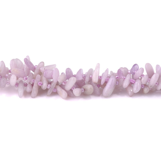 This is a Dakota Stones 5x10-20mm Kunzite Top Drill Teeth Gemstone strand of round beads in 15-16 inch strand.