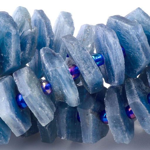 This is a Dakota Stones 5x14-16mm Kyanite Hexagon Wheel Gemstone strand with free-form beads in 15-16 inch strand.
