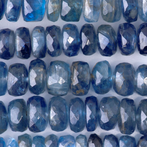 This is a Dakota Stones 3x6-5x8mm Blue Nepal Kyanite Grauated Necklace Gemstone strand with faceted rondelle beads in 15-16 inch strand.