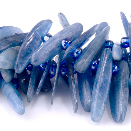 This is a Dakota Stones 5x10-20mm Blue Kyanite Top Drill Teeth Gemstone strand of round beads in 15-16 inch strand.