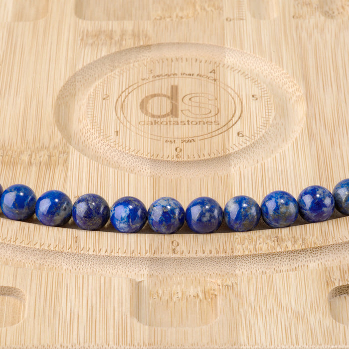 This is a Dakota Stones 10mm Lapis Gemstone strand with round beads in 15-16 inch strand.