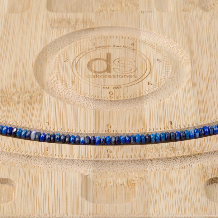 This is a Dakota Stones 2x4mm Lapis Gemstone strand with faceted rondelle beads in 15-16 inch strand.