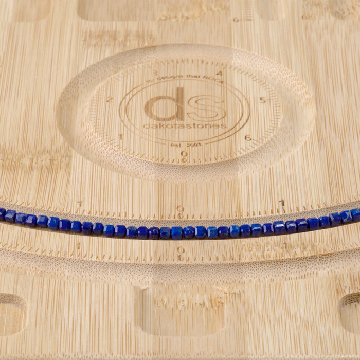 This is a Dakota Stones 3mm Lapis Gemstone strand with AAA grade table-cut cube beads in 15-16 inch strand.