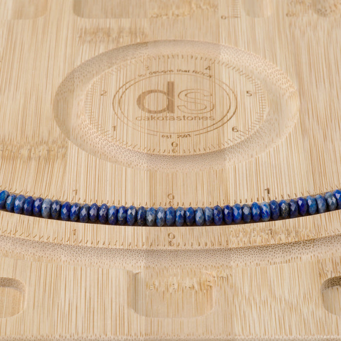 This is a Dakota Stones 3x6mm Lapis Gemstone strand with faceted rondelle beads in 15-16 inch strand.