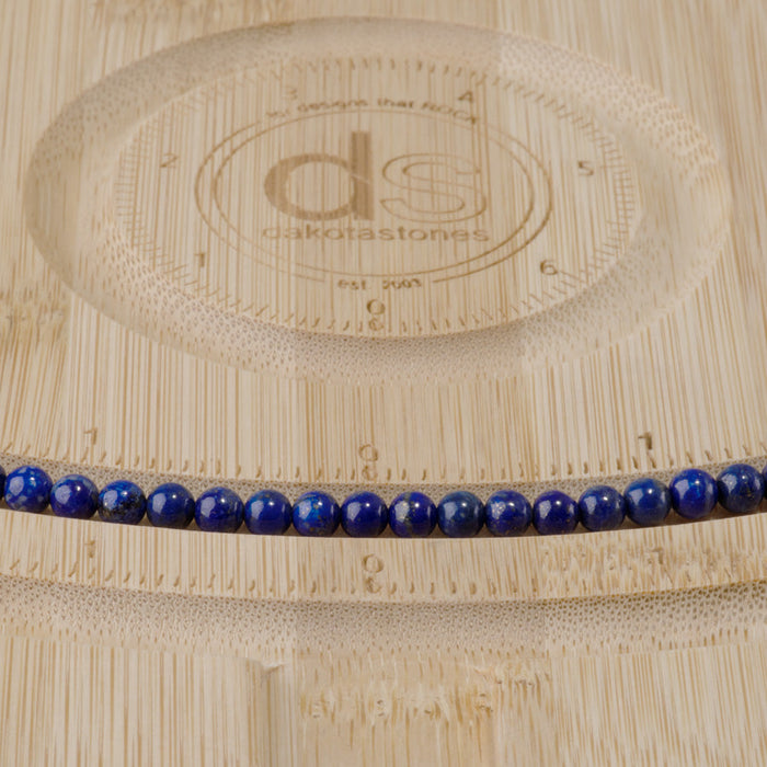 This is a Dakota Stones 4mm Lapis Gemstone strand with AAA grade round beads in 15-16 inch strand.