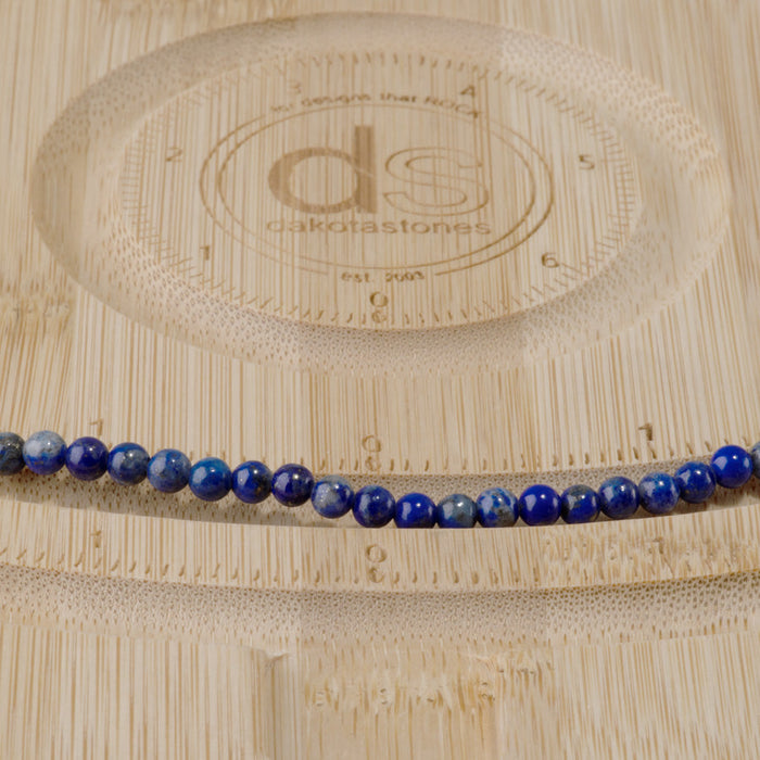 This is a Dakota Stones 4mm Lapis Gemstone strand with round beads.