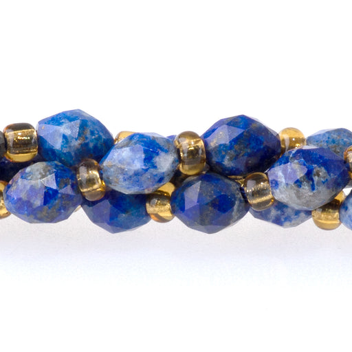 This is a Dakota Stones 4x6mm Lapis Triangle Cut Rice Gemstone strand with A grade faceted beads in 15-16 inch strand.