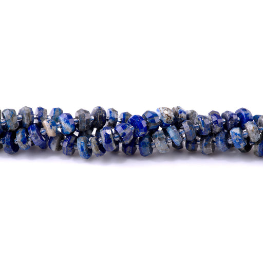 This is a Dakota Stones 8x10-12mm Lapis Irr Gemstone strand with faceted rondelle beads in 15-16 inch strand.