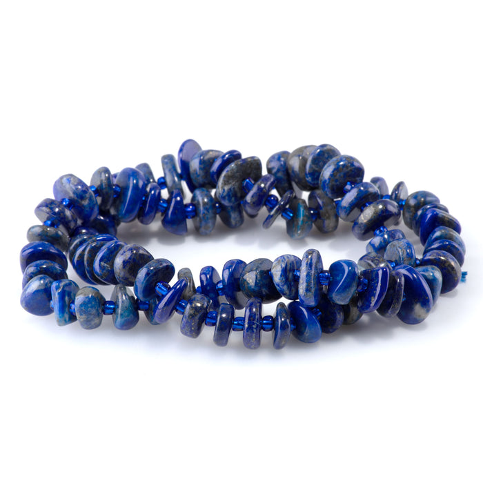 This is a Dakota Stones 5x8mm Lapis Gemstone strand with chip beads in 15-16 inch strand.