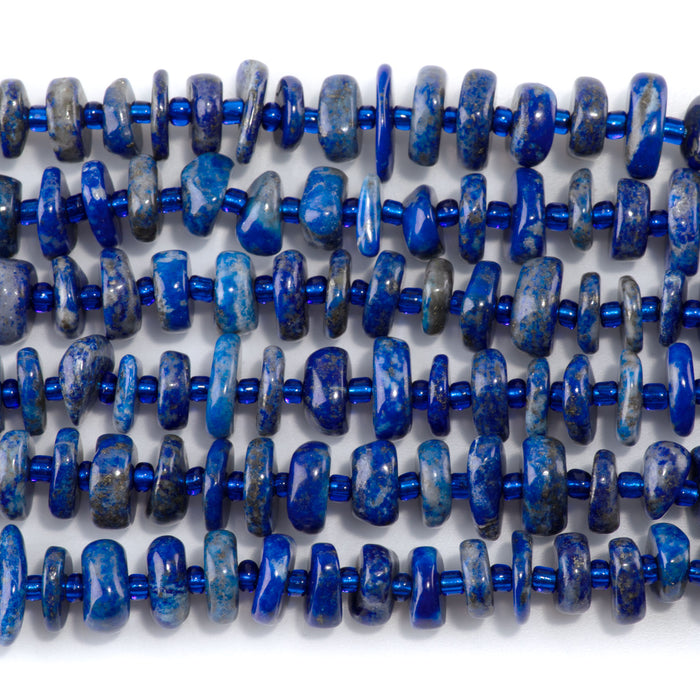 This is a Dakota Stones 5x8mm Lapis Gemstone strand with chip beads in 15-16 inch strand.
