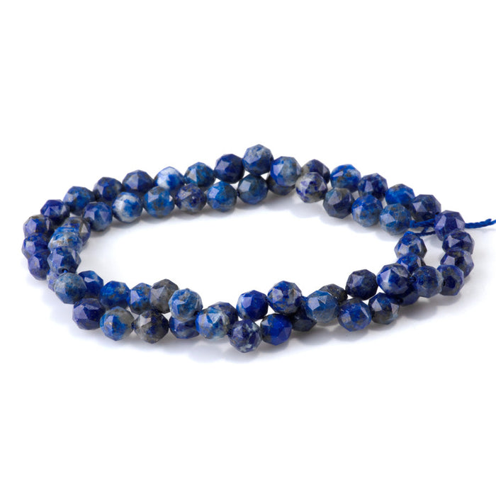 This is a Dakota Stones 6mm Lapis Gemstone strand with double heart faceted round beads in 15-16 inch strand.
