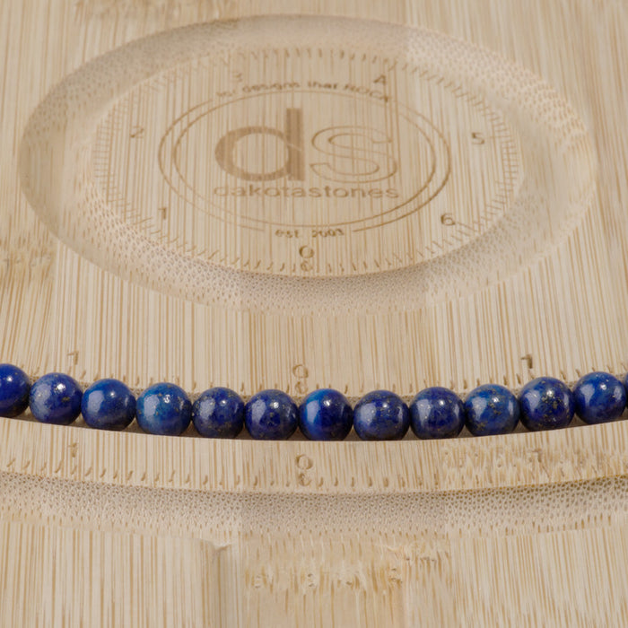 This is a Dakota Stones 6mm Lapis Gemstone strand with round beads in 15-16 inch strand.
