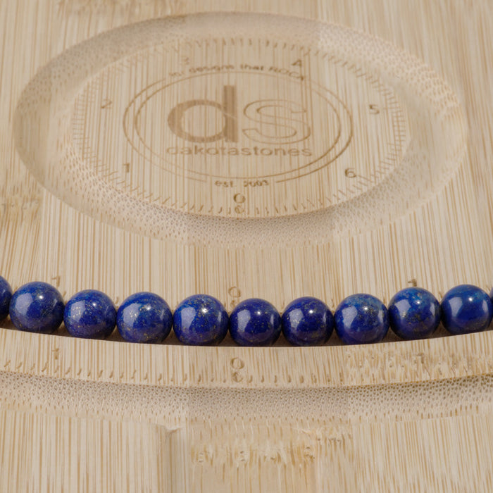 This is a Dakota Stones 8mm Lapis Gemstone strand with AAA grade round beads in 15-16 inch strand.