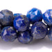 This is a Dakota Stones 8mm Lapis Gemstone strand with double heart faceted round beads in 15-16 inch strand.