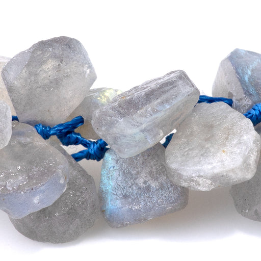 This is a Dakota Stones 10x13mm Labradorite Gemstone strand with irregular tear drop beads in 15-16 inch strand.
