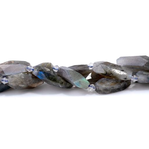 This is a Dakota Stones 12x28-15x30mm Labradorite Gemstone strand with AA grade faceted nugget beads in 15-16 inch strand.