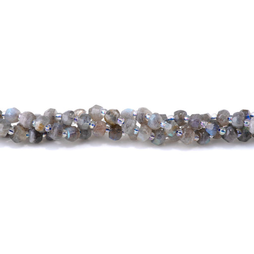 This is a Dakota Stones 5x7mm Labradorite Irr Gemstone strand with faceted rondelle beads in 15-16 inch strand.
