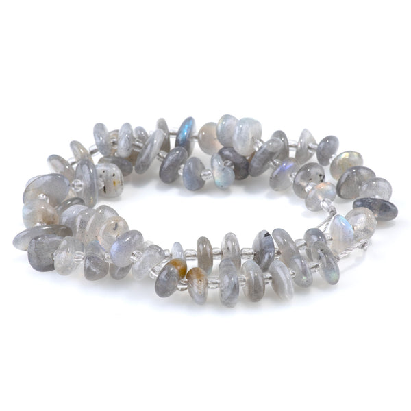 This is a Dakota Stones 5x8mm Labradorite Chips Gemstone strand of round beads in 15-16 inch strand.