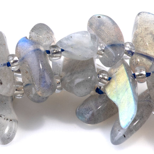 This is a Dakota Stones 6x12-10x20mm Labradorite Dancing Drops Gemstone strand with A grade free-form beads in 15-16 inch strand.