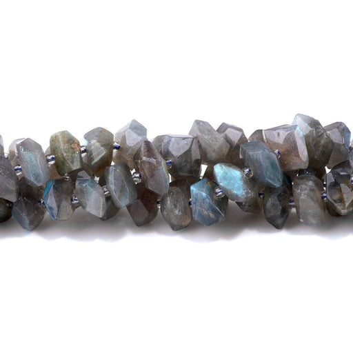 This is a Dakota Stones 8x12-10x14mm Labradorite Drill Gemstone strand with A grade faceted nugget beads in 15-16 inch strand.