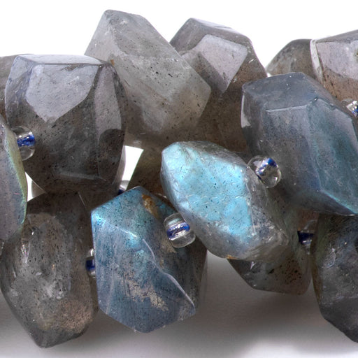 This is a Dakota Stones 8x12-10x14mm Labradorite Drill Gemstone strand with A grade faceted nugget beads in 15-16 inch strand.