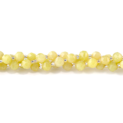 This is a Dakota Stones 7x8mm Lemon Jade Serpentine Gemstone strand with faceted nugget beads in 15-16 inch strand.